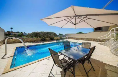 Casa com 5 quartos à venda, 460 m²  em condomínio fechado