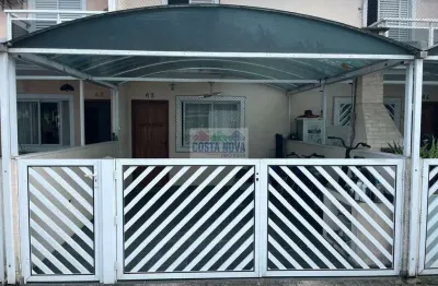 Sobrado em condomínio fechado com lazer e segurança em são vicente