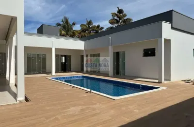 Casa de alto padrão com 4 suítes e lazer completo no condomínio campo alegre
