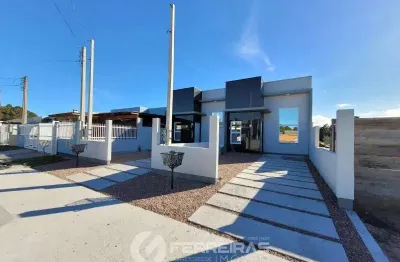 Venda de linda casa geminada com 2 doritórios no centro de imbé !