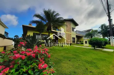 Condomínio arujá 5 - fantástica casa alto padrão à locação no arujá 5 com 4 suítes, hidromassagem, sauna e piscina!