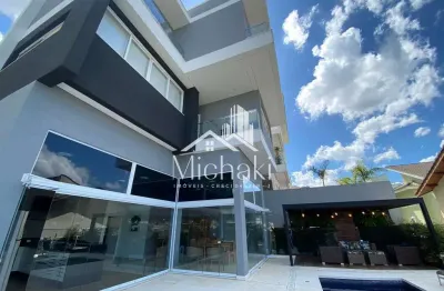 Condomínio arujá 5 - casa de  alto padrão com 4 suites e piscina no condomínio aruá 5