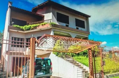 Casa em condomínio fechado com 4 quartos à venda na avenida jacuí, 1200, cristal, porto alegre, 460 m2 por r$ 1.800.000