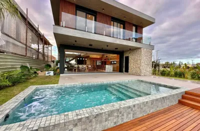 Casa em condomínio fechado com 5 quartos à venda na pedro hygino da silveira, 1885, centro, xangri-lá, 315 m2 por r$ 5.490.000