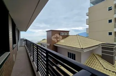 Apartamento com 2 dormitorios churrasqueira e sacada em praia de fora palhoça