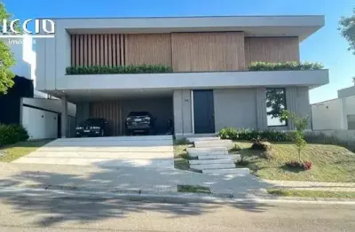 Casa à venda no condomínio colinas do paratehy norte - 4 suìtes, piscina,