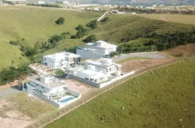 Terreno de 725 m² no cond. montserrat urbanova, quadra f - em aclive - fundos para área verde