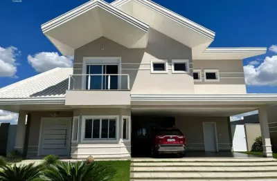 Linda casa de 366m2 área construída no condomínio reserva do paratehy - 4 suítes