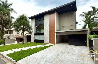 Belíssima casa de 500m², 4 quartos, 4 suítes, 6 vagas no cond. alpha ii.