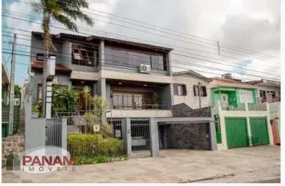 Casa com 5 quartos à venda na beco circular, 631, vila jardim, porto alegre por r$ 1.980.000