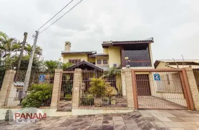 Casa com 4 quartos à venda na travessa porto príncipe, 59, jardim lindóia, porto alegre por r$ 1.690.000