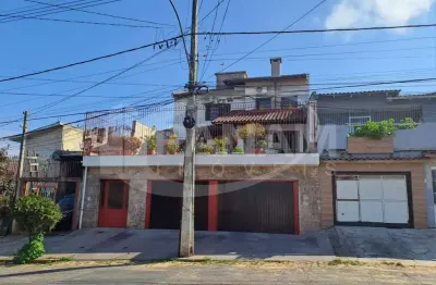 Casa com 4 quartos à venda na rua arnaldo ballve, 709, jardim itu sabará, porto alegre por r$ 1.080.000