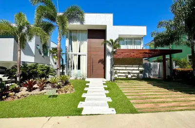 Alphaville litoral norte 1 | casa 306m² com 4 suítes | moderna | piscina | área gourmet | energia solar