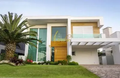 Belíssima sobrado no condomínio enseada! com 06 suítes