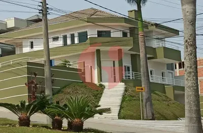 Sobrado em condomínio para venda com 04 quartos (5 suítes) e 08 vagas de garagem - 900m² no jaguary