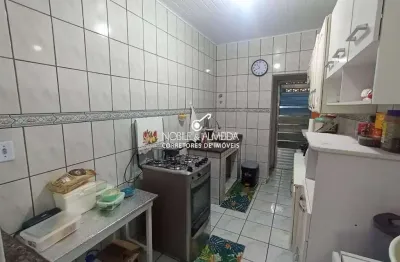 Casa à venda na Avenida Juscelino Kubitschek de Oliveira, Caiçara, Praia Grande - SP