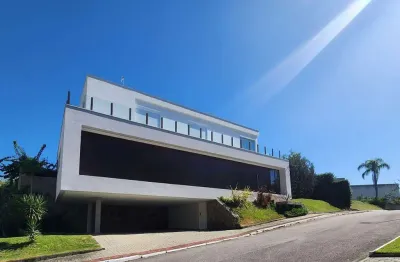 Casa com 4 suítes à venda em condomínio no cacupé, florianópolis