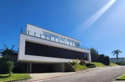 Casa 4 suítes à venda em condomínio no cacupé, florianópolis/sc