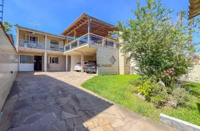 Sobrado com 4 dormitórios sendo 1 suíte. bairro estância velha - canoas.