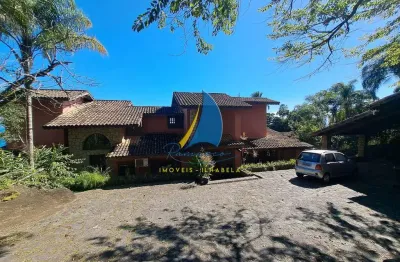 Casa à venda em costeira na ilhabela-sp, bairro ponta das canas: 5 quartos, 5 suítes, 3 salas, 8 banheiros, pier para embarcação até 75 pés, 2 poitas.