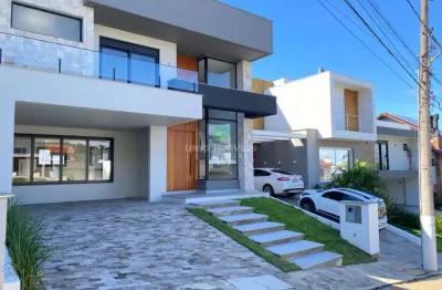 Luxuosa casa em condomínio à venda em porto alegre-rs, bairro hípica. 3 quartos, 3 suítes, 3 salas, 4 banheiros, 2 vagas de garagem, 200m².