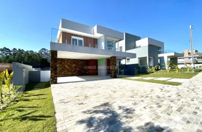 Sobrado composto por 3 suítes, sendo uma suíte master com banheira, living moderno com lareira composto por 3 ambientes,  sala de estar e jantar , abe