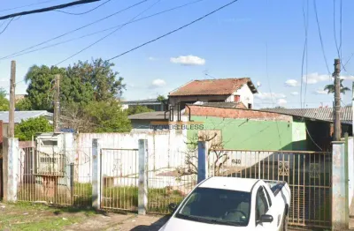 Terreno com duas casa no pátio localizado no bairro harmonia/canoas