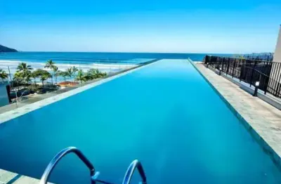 Lindo apartamento frente mar na praia grande com piscina no rooftop