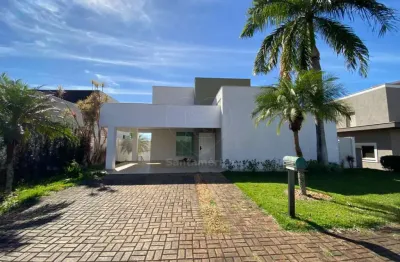 Casa para locação no condomínio fechado sun lake com 4 suítes e cozinha planejada
