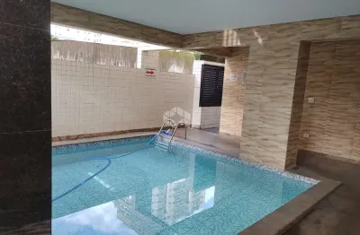 Apartamento a venda na praia grande, bairro caiçara, repasse de financiamento com 2 quaros, 2 suites e 1 vaga