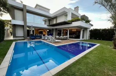 Casa com 6 quartos à venda na rua das caraúnas, 49, jurerê internacional, florianópolis por r$ 12.000.000