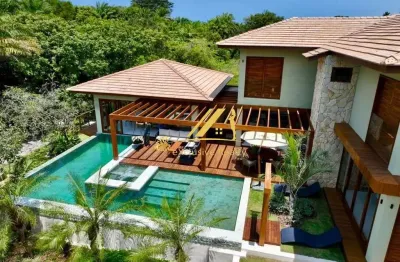 Casa extraordinária no condomínio praia bella em praia do forte. 6 suítes, 500m2 de área construída, a 700m da praia! finamente decorada e mobiliada!