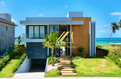 Casa fantástica com 7 suítes, pé na areia no alphaville guarajuba. com academia, spa, hidro, piscina beira mar. condomínio com total infraestrutura!