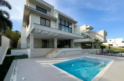 Casa à venda com 4 suítes no residencial jatibela, campinas.