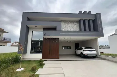 Linda casa em indaiatuba, construção recente, três suítes, escritório, jacuzzi e aquecimento solar localizada no condomínio park gran reserve