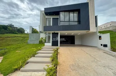 Casa subtérrea com 4 suites plenas, sendo uma master.