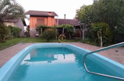 Imperdível, imóvel com duas casas, 380m² construídos em terreno lindo em plano de 1500m² em nova santa rita/rs