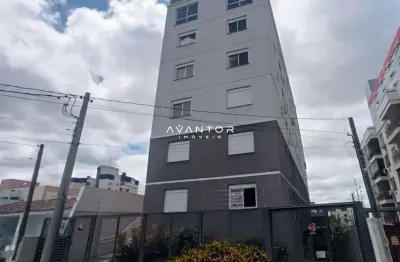 Apartamento central de 1 dormitório, suíte, sala de estar, cozinha e churrasquei