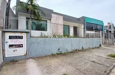 Casa comercial ampla no bairro lourdes com 4 salas, 3 banheiros, pátio e estacio