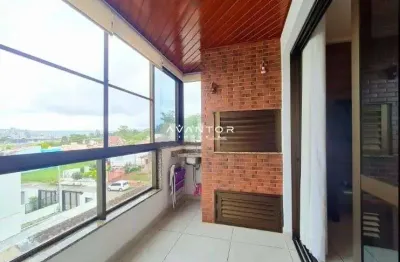 Apartamento 2 dormitórios com suíte e sacada com churrasqueira em bairro nobre.