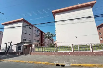 Apartamento amplo de 3 dormitórios, sala de estar, cozinha, e estacionamento.
