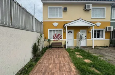 Casa em condomínio fechado com 2 quartos para alugar na Avenida Santos Ferreira, 1180, Marechal Rondon, Canoas por R$ 3.500