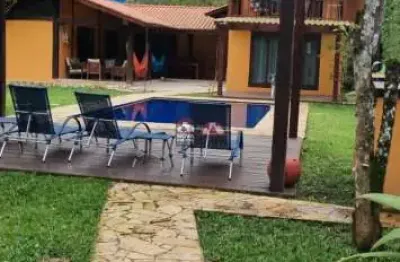 Casa à venda de 4 dormitórios em camburí - são sebastião/sp