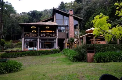 Casa em condomínio para venda com 4 quartos, sendo 3 suítes, 630m²