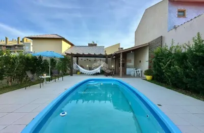 Casa com 5 quartos à venda na das rosas, 4176, capão novo, capão da canoa por r$ 1.000.000