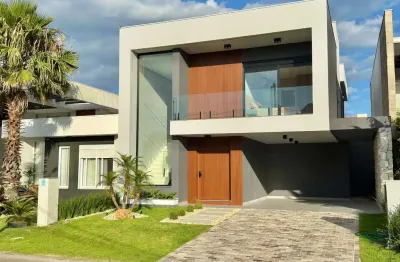 Casa em condomínio fechado com 4 quartos à venda na rua rio camisas, 15, centro, xangri-lá por r$ 2.690.000