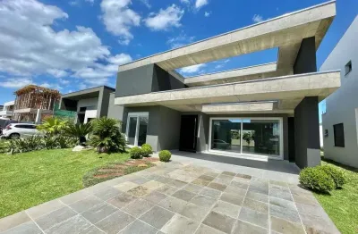 Casa em condomínio fechado com 4 quartos à venda na rua onório germano, 2009, condomínio dubai resort, capão da canoa, 220 m2 por r$ 1.650.000
