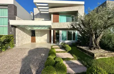 Casa em condomínio fechado com 5 quartos à venda na central, 2000, zona nova, capão da canoa, 248 m2 por r$ 2.790.000