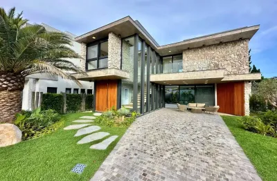 Casa em condomínio fechado com 4 quartos à venda na avenida interbalneários, 436, condomínio porto coronado, xangri-lá por r$ 4.350.000