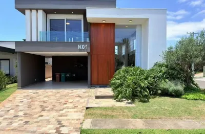 Casa em condomínio fechado com 4 quartos à venda na rua andira, 1200, parque antártica, capão da canoa por r$ 3.890.000